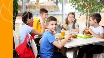 Middle school students sitting together, highlighting friendships and social life.