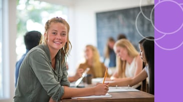 Middle schooler smiling and showing completed homework as a small win.