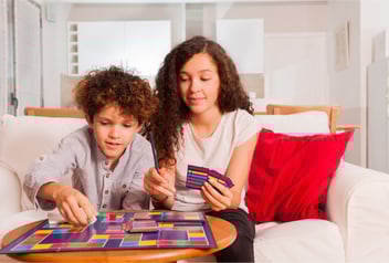 two siblings problem solving through a board game